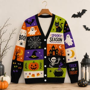 May include: A V-neck button-down cardigan featuring a colorful patchwork pattern of Halloween motifs including ghosts, a black cat, a haunted house, a skeleton, a pumpkin, a witch hat, spiderwebs, and the text "SPOOKY SEASON" and "TRICK OR TREAT".