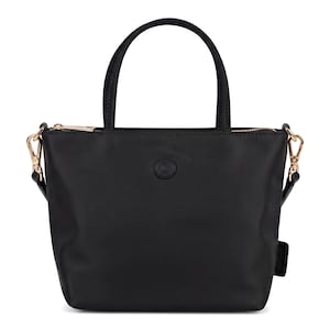 May include: A black handbag with a smooth finish, featuring two top handles and a detachable shoulder strap with gold-toned metal hardware. The bag has a top zipper closure and a circular logo emblem centered on the front exterior surface.
