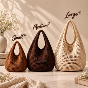 May include: Three crochet bags in small, medium, and large sizes. The small bag is rust-colored, the medium bag is dark brown, and the large bag is cream-colored. Each bag features a single integrated handle and the text Small, Medium, and Large.
