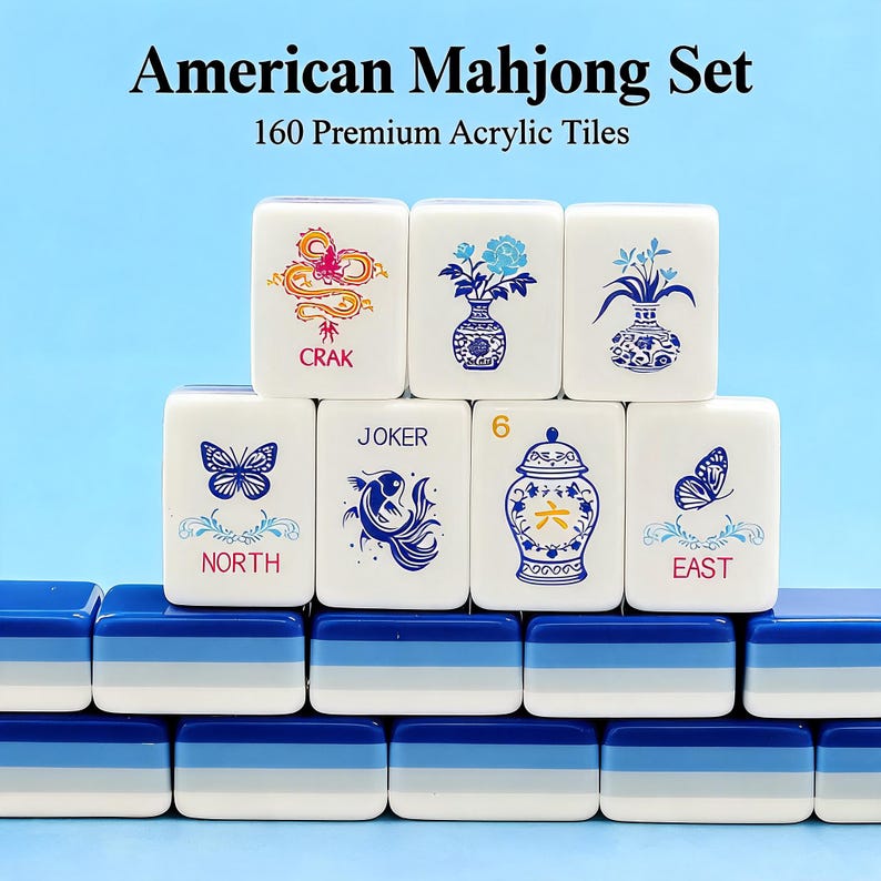 May include: An American Mahjong set featuring 160 premium acrylic tiles. The white tiles display blue, red, and yellow graphics including a dragon, flowers, a butterfly, a fish, and a vase. The tiles are stacked on blue, light blue, and white bases.