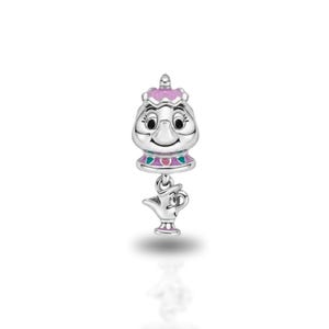 May include: A silver charm featuring a stylized teapot character with a pink lid and teal and pink accents, with a smaller dangling silver teapot charm attached below. The design includes black enamel details for the eyes and a smiling mouth.