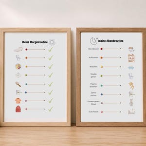 May include: Two framed prints in light wood frames featuring daily routine checklists. The left print titled Meine Morgenroutine shows morning tasks with icons and green checkmarks. The right print titled Meine Abendroutine shows evening tasks with icons and colored dots.