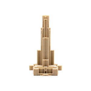 May include: A beige, monochromatic 3D-printed architectural model of a tall skyscraper with a stepped, tiered design. The structure features vertical columns, numerous rectangular window cutouts, and a central tower rising from a wide base.