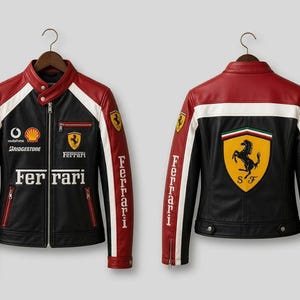 May include: A black, red, and white leather jacket featuring the Ferrari logo, the word Ferrari, and sponsor logos including Vodafone, Shell, and Bridgestone. The jacket is shown from both the front and back, with a large prancing horse emblem on the back.