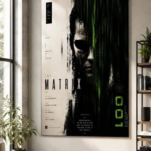 May include: A vertical rectangular wall art print featuring a stylized portrait of a person wearing sunglasses, partially obscured by cascading green digital code. The design includes the text THE MATRIX, 1999, and various movie details.