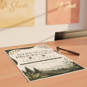 May include: A rectangular strength progression lift sheet printed on paper with a forest theme featuring pine trees and leaves. The text reads STRENGTH PROGRESSION LIFT SHEET TRACK PLAN PROGRESS with a barbell icon. A black pen lies beside the paper.