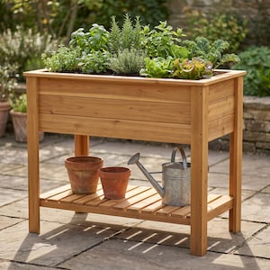 May include: A rectangular wooden raised garden bed with a lower slatted shelf. The top container is filled with various green herbs and leafy greens. On the lower shelf sit two terracotta pots and a galvanized metal watering can with a handle.