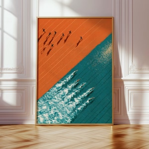 May include: A rectangular wall art print featuring a split composition. The top left section shows runners on an orange track casting long shadows. The bottom right section depicts swimmers in a teal pool creating white water wakes.