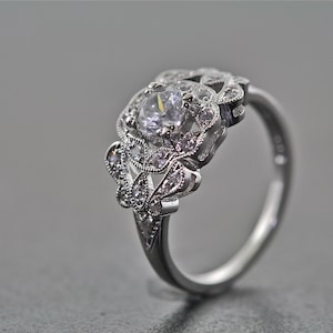 14kt White Gold and Diamond Estate Style Art Deco Design Engagement Ring With A .50 Carat Sapphire Center