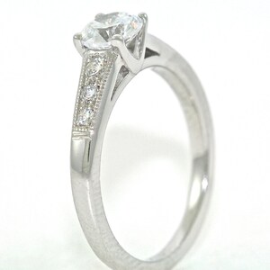 Platinum and Diamond Solitaire Engagement Ring with .54ct Moissanite