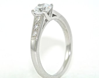 Platinum and Diamond Solitaire Engagement Ring with .54ct Moissanite