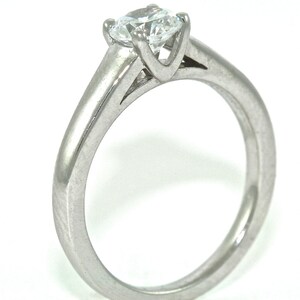 Platinum and Diamond Solitaire Engagement Ring with .54ct Moissanite