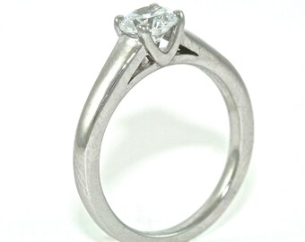 Platinum and Diamond Solitaire Engagement Ring with .54ct Moissanite