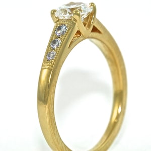 14kt Yellow Gold and Diamond Solitaire Engagement Ring with .54ct Moissanite
