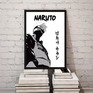 May include: A black and white framed poster featuring a graphic illustration of the character Kakashi Hatake from Naruto. The artwork displays the text NARUTO at the top and Japanese characters vertically on the right side, set against a white background.