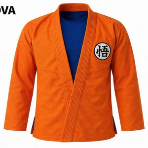 May include: An orange martial arts gi jacket with long sleeves and a ribbed collar, worn over a solid blue t-shirt. A circular white patch with black Japanese kanji is on the left chest. The word SPORTNOVA is printed in black in the top left corner.