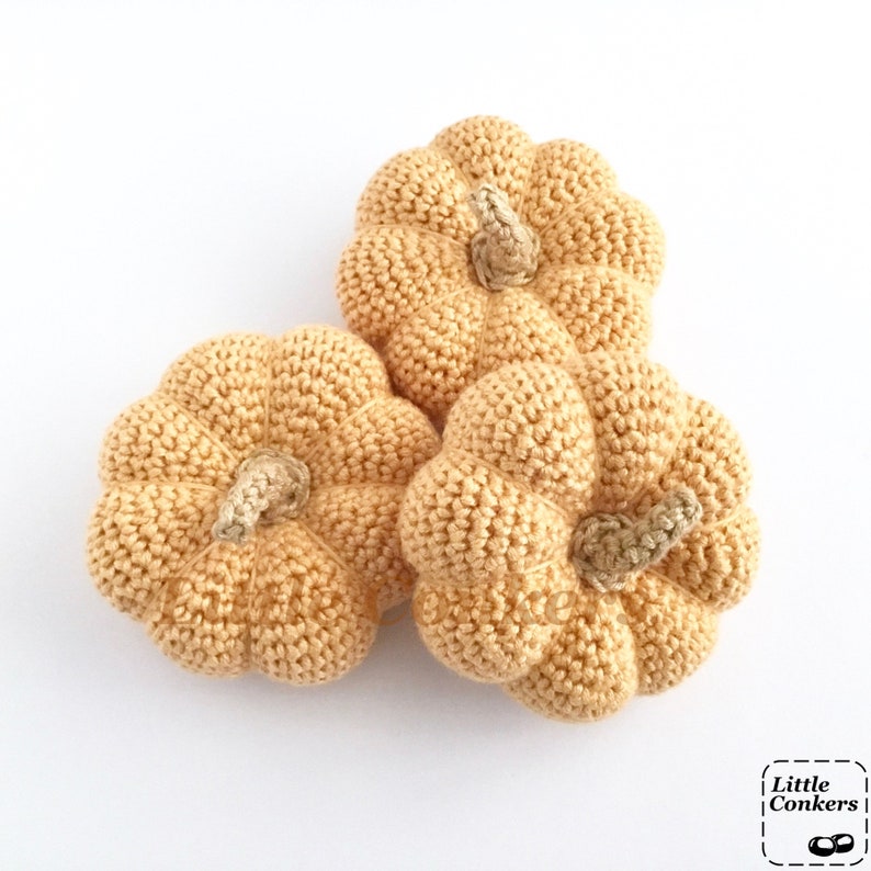 Crocheted pale orange pumpkins