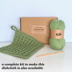 May include: A crochet kit for making a green dishcloth. The kit includes yarn, a crochet hook, and instructions. "Little Conkers Crochet Kit" is printed on the box.