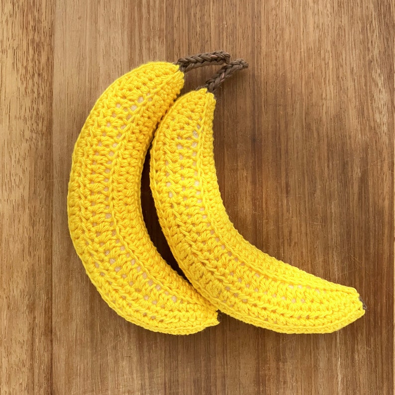 Two realistic crocheted bananas.