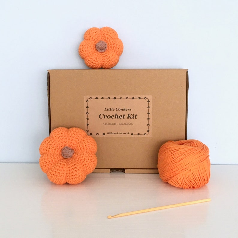 Crochet kit to make mini pumpkins in a kraft box