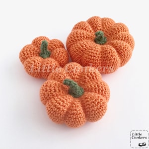 Crocheted orange pumpkins in different sizes