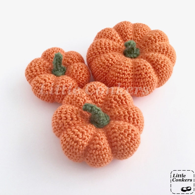 Crocheted orange pumpkins in different sizes