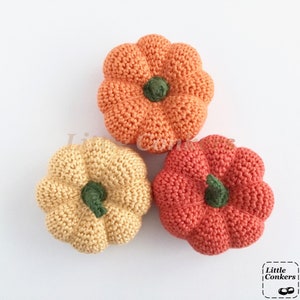 Crocheted mini pumpkins in different shades of orange