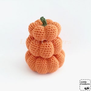 Crocheted orange pumpkins in different sizes