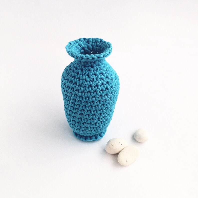 Crocheted bud vase.