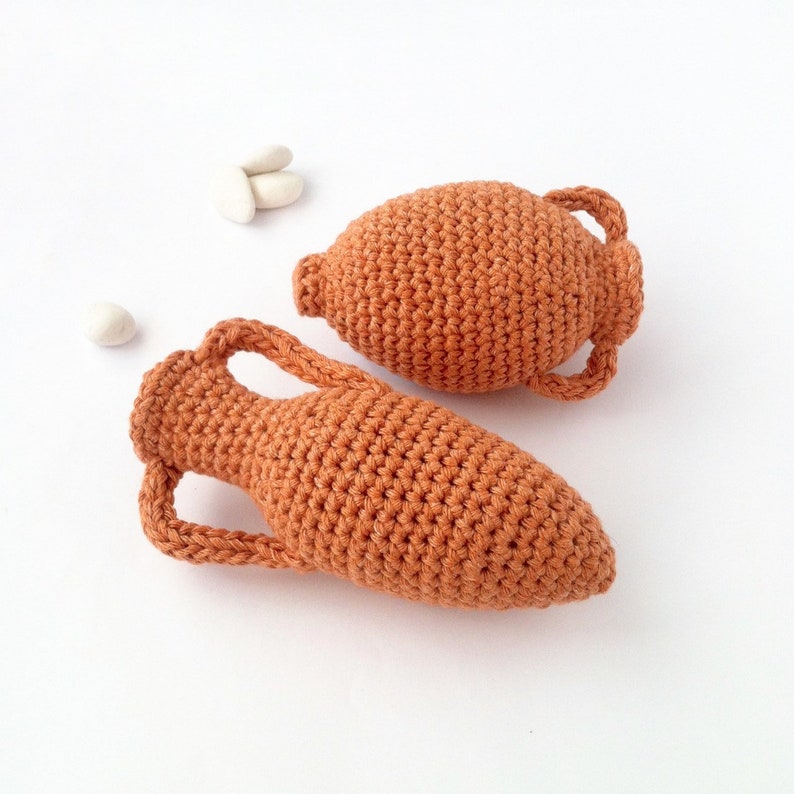 Crocheted miniature amphorae of different shapes.