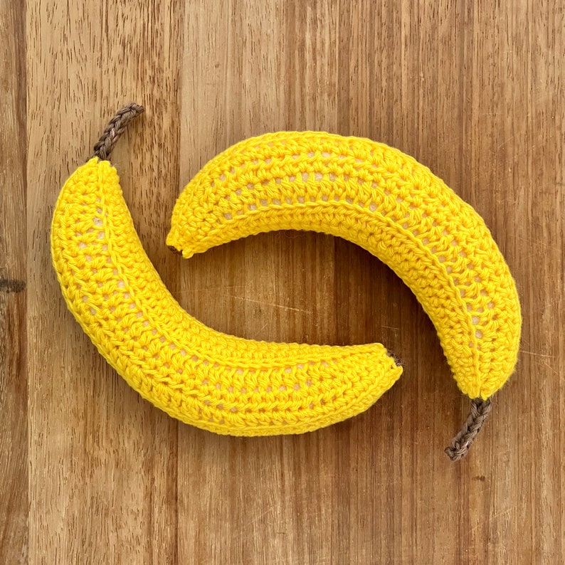 Two realistic crocheted bananas.