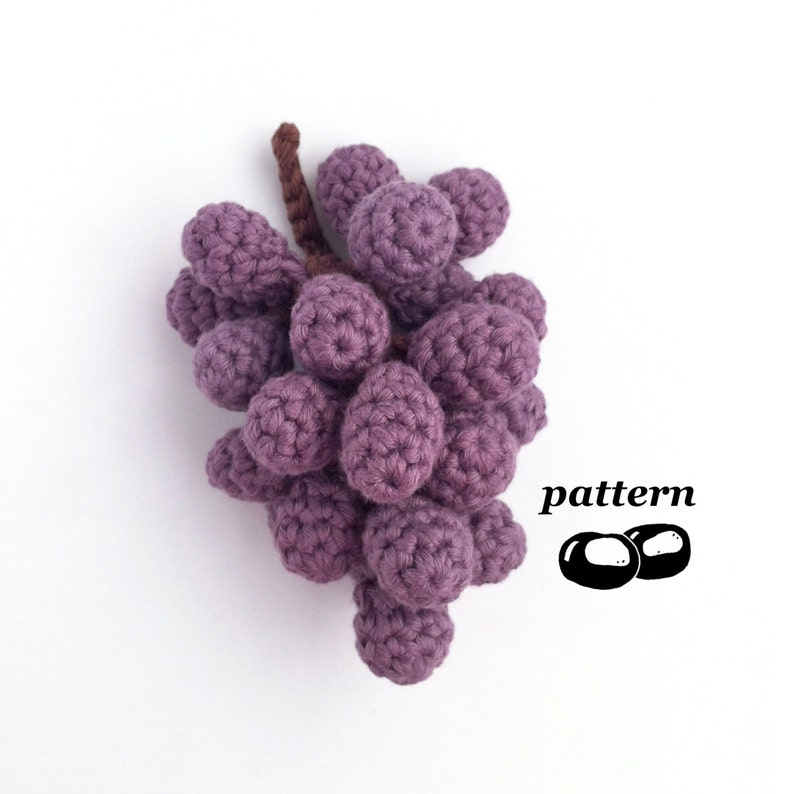 A realistic crocheted bunch of purple grapes.