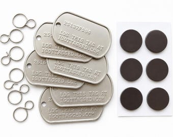 Six I GOT TAGGED stainless steel tags with unique codes