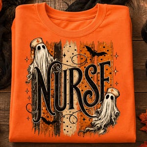 May include: An orange crewneck sweatshirt featuring a graphic print with the word NURSE in large black lettering. Two white ghosts wearing nurse caps are positioned around the text, accompanied by black bats and small star accents.