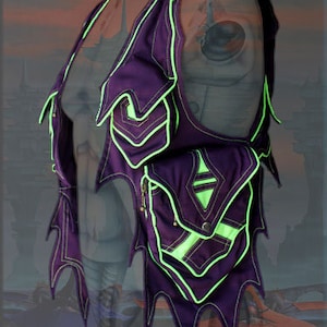 May include: Purple vest with neon green trim and a pointed, jagged design. The vest has a large pocket on the front with a diamond-shaped design.