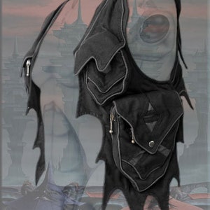 May include: Black leather vest with multiple pockets and a jagged, wing-like design. The vest has a zipper closure and a silver chain detail.