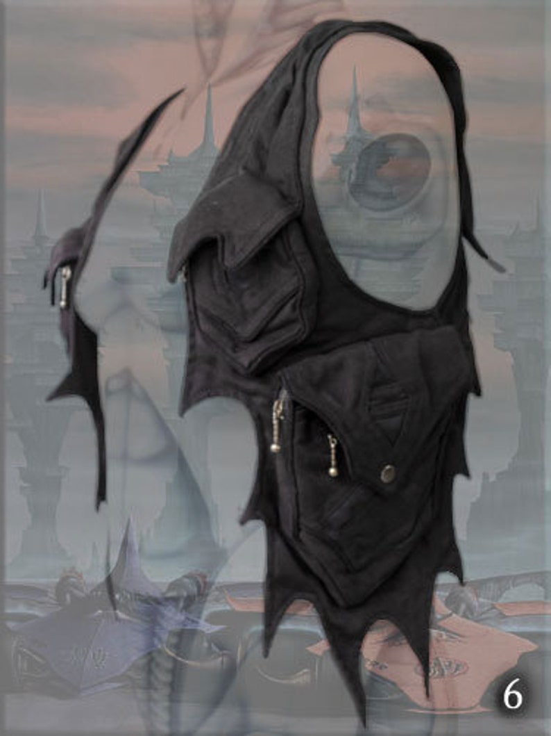 May include: Black leather shoulder bag with multiple pockets and a jagged, pointed design. The bag has a zipper closure and silver hardware.