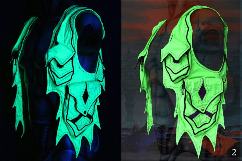 May include: A green vest with black trim and multiple pockets. The vest has a unique design with a jagged edge and a diamond-shaped pocket in the center. The vest is glowing in the dark.