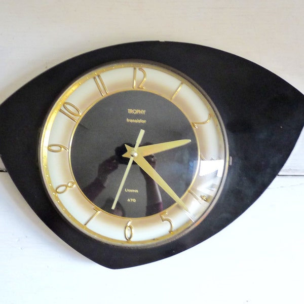Vintage French MID CENTURY Wall CLOCK, Black and Gold Formica Clock from the Brand Trophy. 1960s.