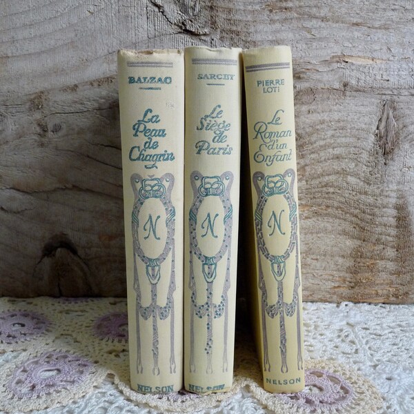 Set 181: Antique Set of 3 Nelson Books, Decorative Set of Cream Colored Books with Ornate Art Nouveau Cover, 1930s.