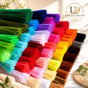May include: A collection of multi-coloured pipe cleaners arranged in bundles, featuring a wide spectrum of hues including green, blue, purple, pink, red, orange, yellow, black, brown, and white. The logo Unique Decor by Imran is visible.