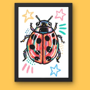 May include: A framed art print featuring a colorful ladybug illustration with black spots and vibrant red, orange, and blue stripes. The design includes pastel stars and abstract dots in pink, yellow, and teal, all set against a white background.