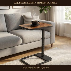 May include: An adjustable height C-shaped side table with a dark wood grain finish top and a black metal frame. The table features a central support column with visible height adjustment holes and a flat, rectangular base for stability.