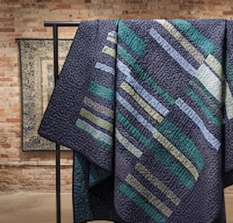 Patchwork quilt pattern with diagonal teal and cream stripes, modern bed quilt design