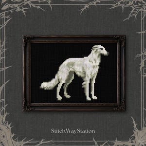 May include: A cross-stitch pattern featuring a white Borzoi dog standing in profile against a solid black background, enclosed in a dark ornate rectangular frame. The text StitchWayStation is printed in white at the bottom of the image.