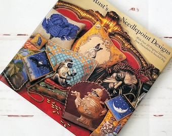 Hardcover book full of colorful needlepoint antique look patterns animals Flowers by Graham Rust.