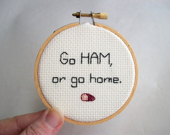 HAM cross stitch -- Go HAM or Go Home mini completed cross stitch in red round frame