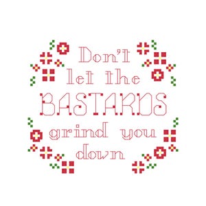 May include: A cross-stitch design on a white background. The text reads "Don't let the BASTARDS grind you down" in red, surrounded by red and green floral accents. The design has a vintage, handmade aesthetic.