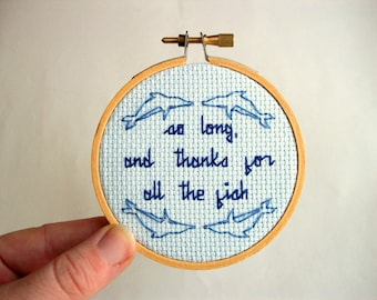 So Long and Thanks cross stitch -- Hitchhiker's Guide inspired completed stitch with dolphins