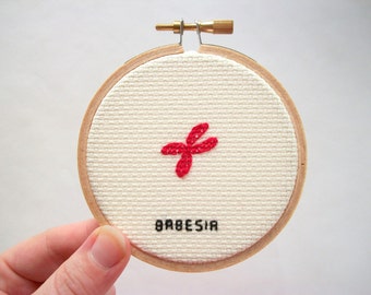 Cross stitch microbe -- Babesia cross stitch, medical or science stitchery, in red blood cells